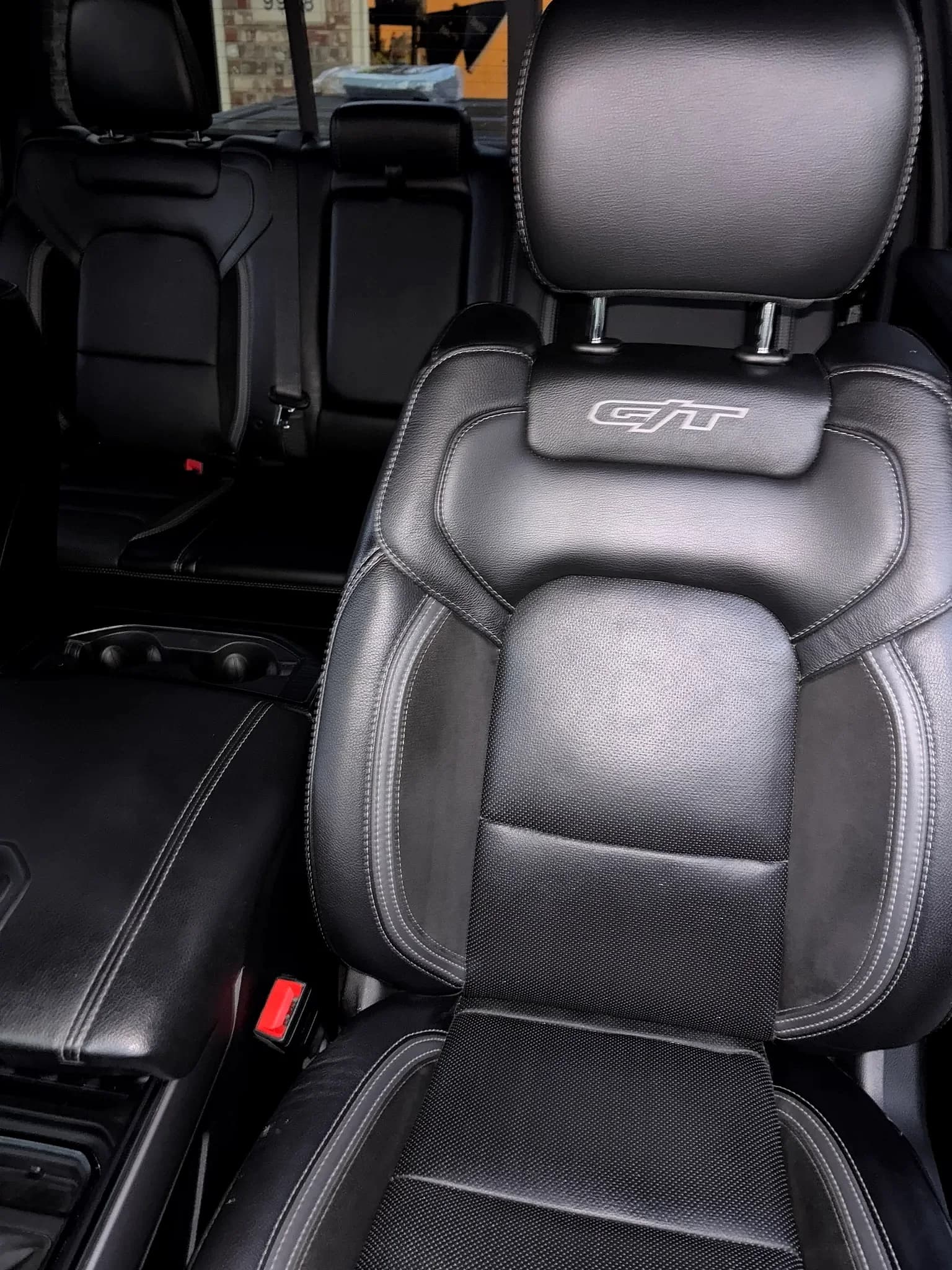 Conditioned black leather GT seat with embroidered logo.