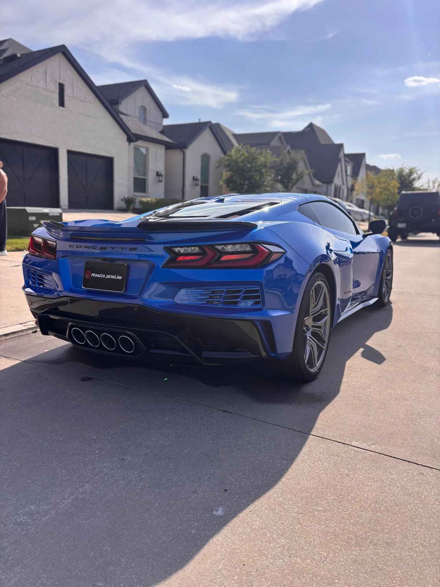 Rear three-quarter view of a blue Chevrolet Corvette C8 Z06 after detailing.