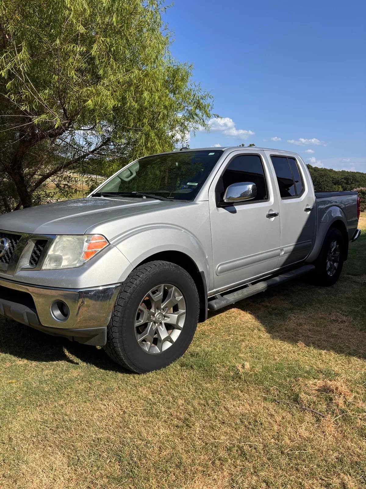 Clean silver Nissan Frontier photographed after its detail.