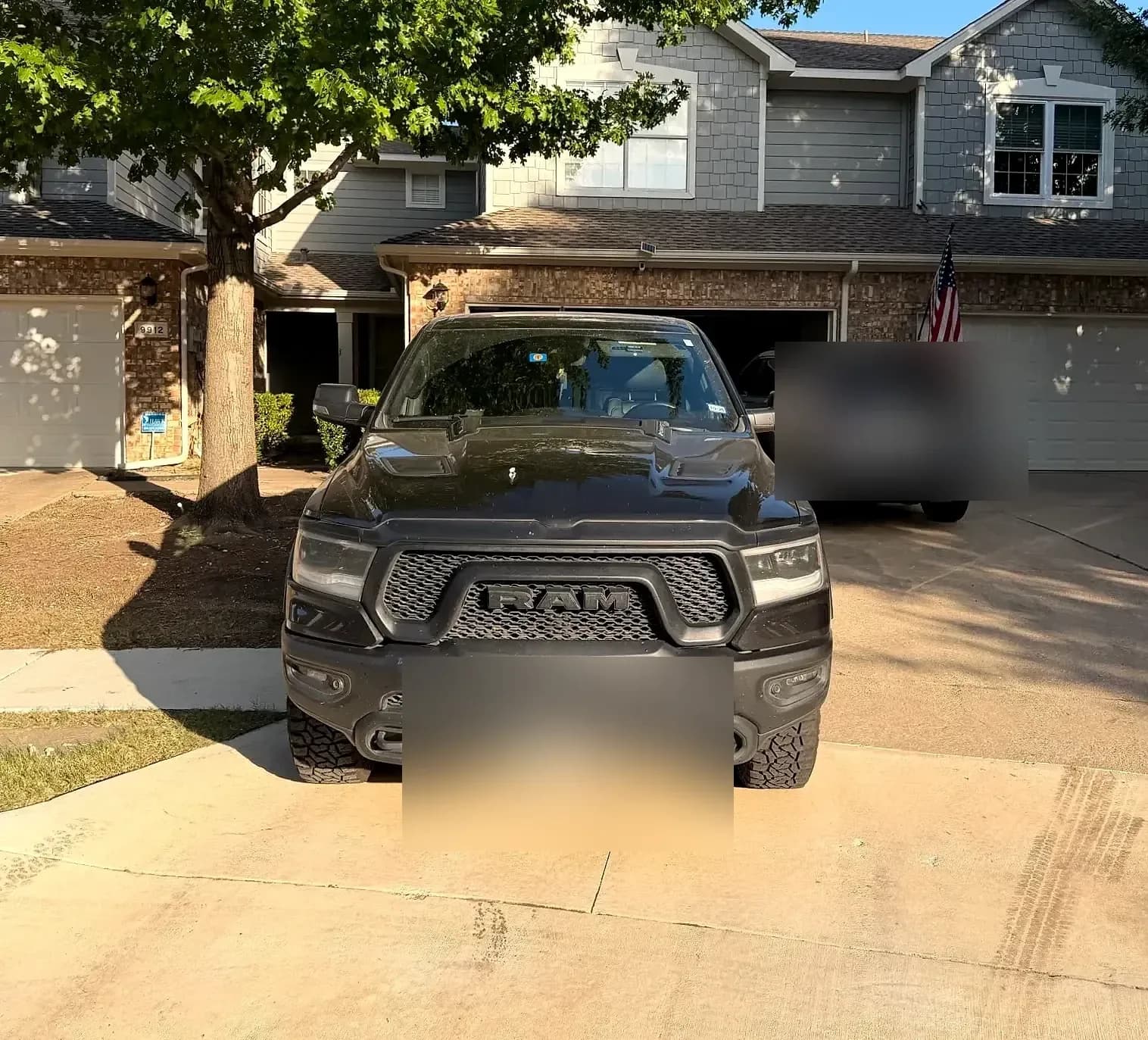 Front end of a black Ram 1500 after a wash and dress.