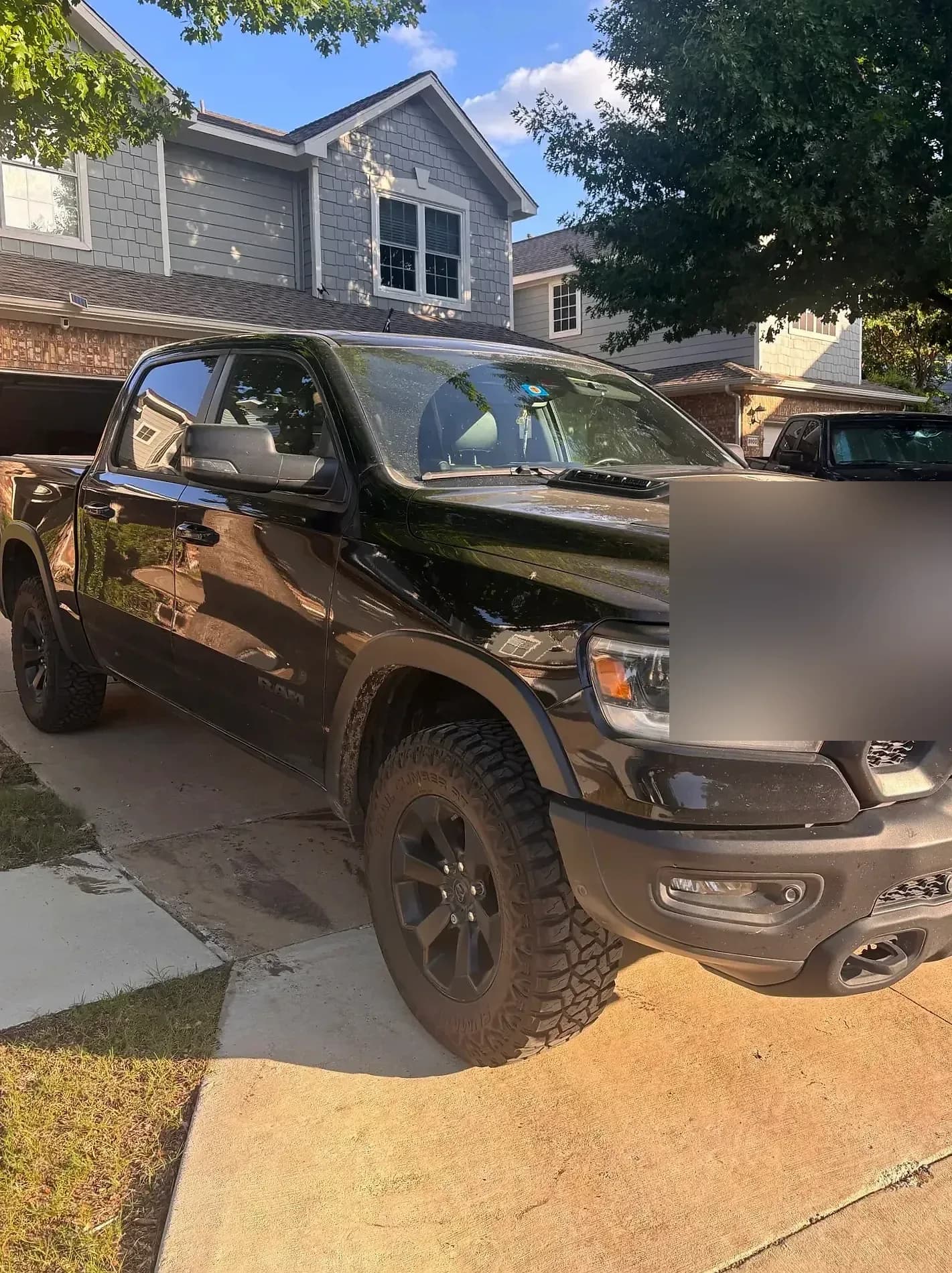 Black Ram 1500 front three-quarter view after detailing.