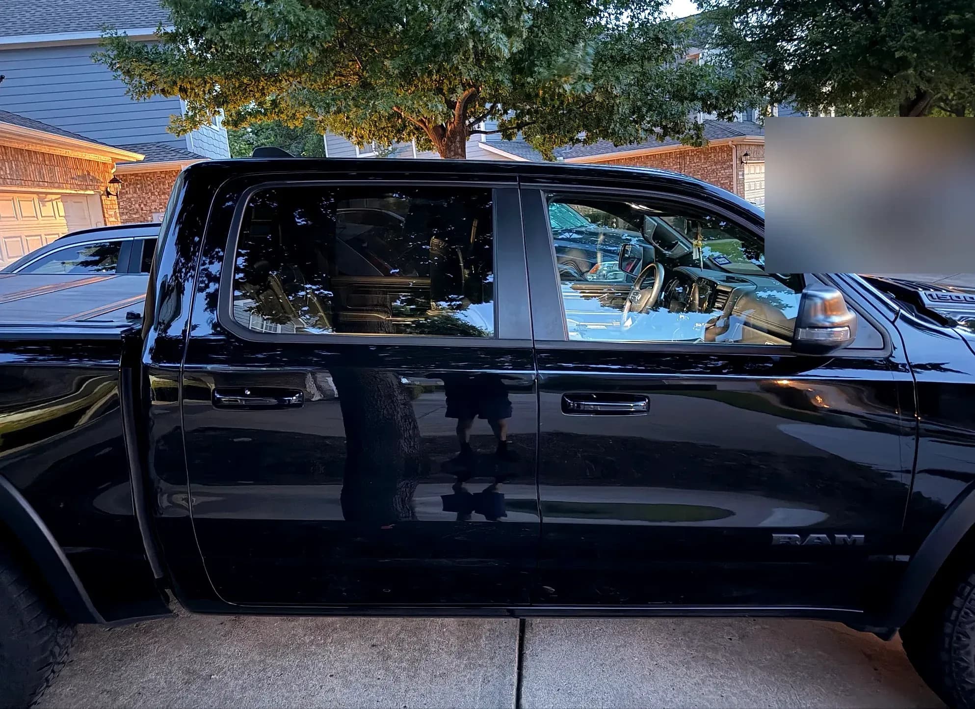 Black Ram 1500 Rebel side profile with a deep, glossy finish after detailing.