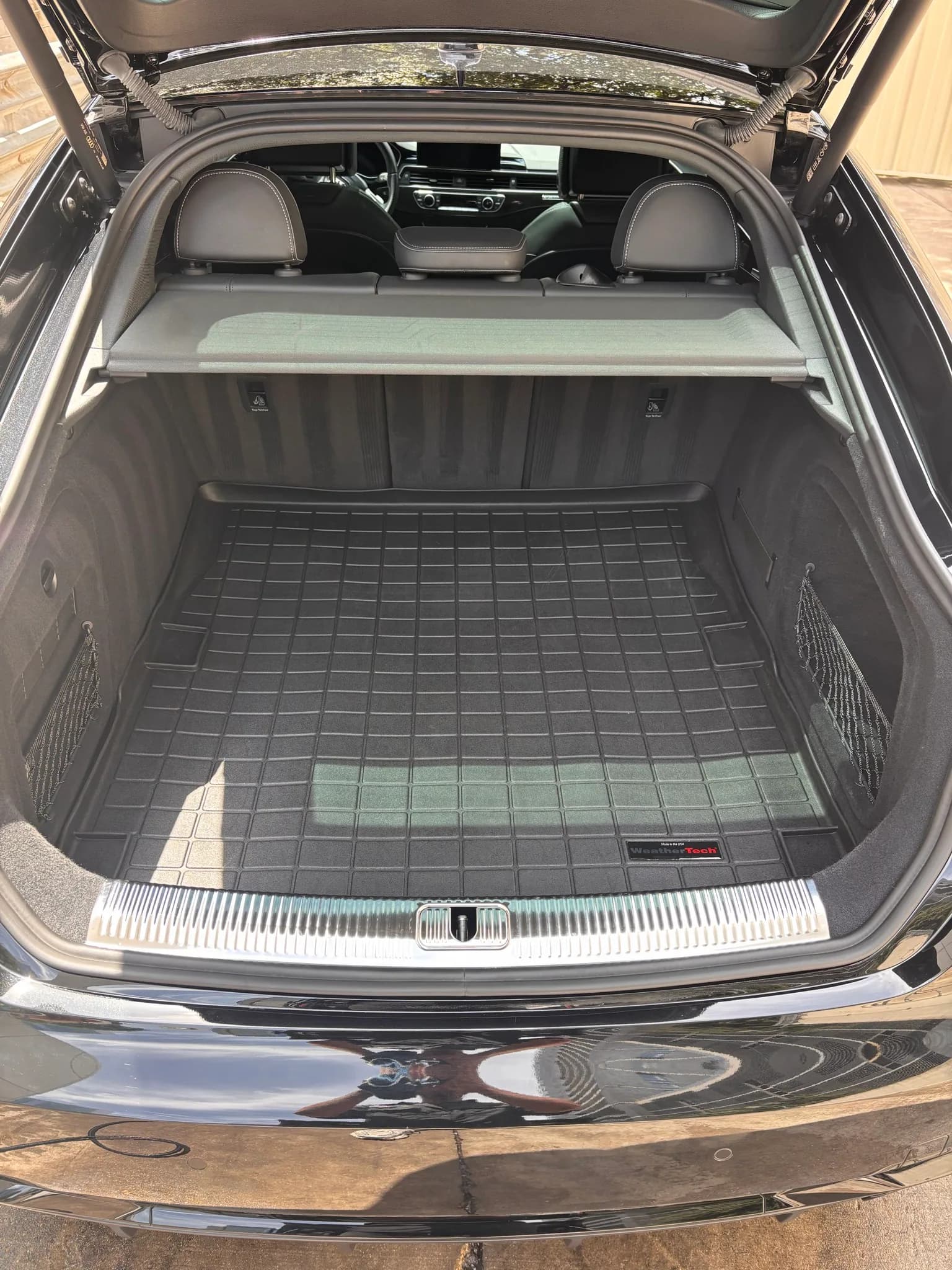 Cleaned trunk area and liner of a black Audi S5 Sportback.