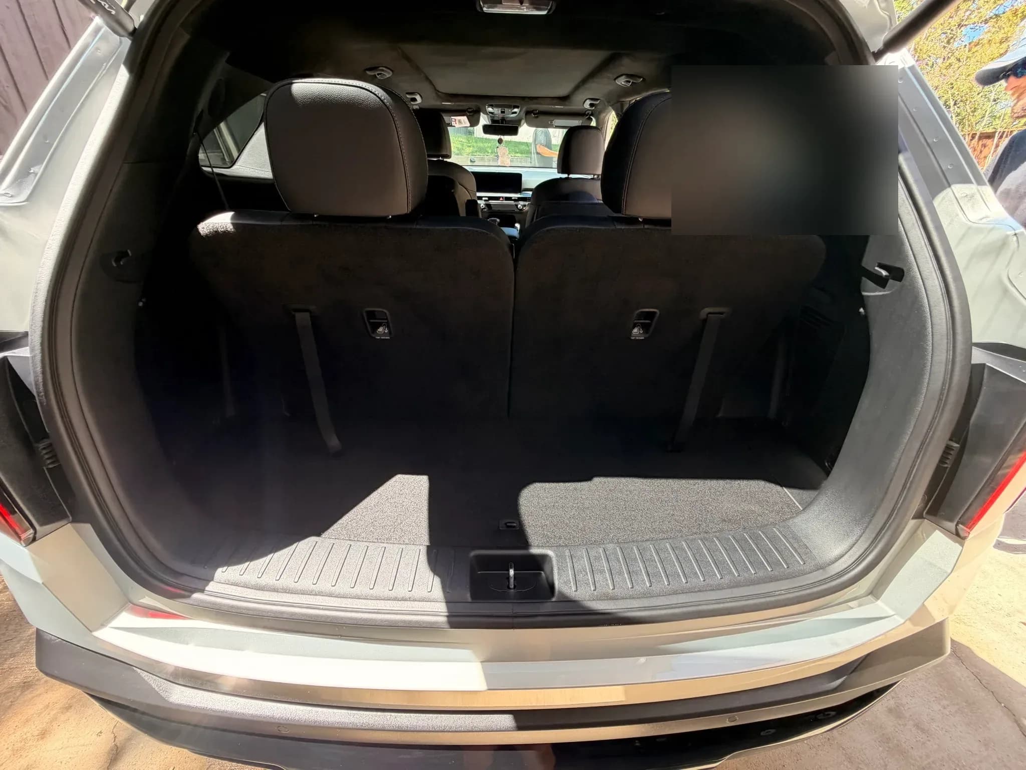 Vacuumed and detailed cargo area inside a Kia Sorento.