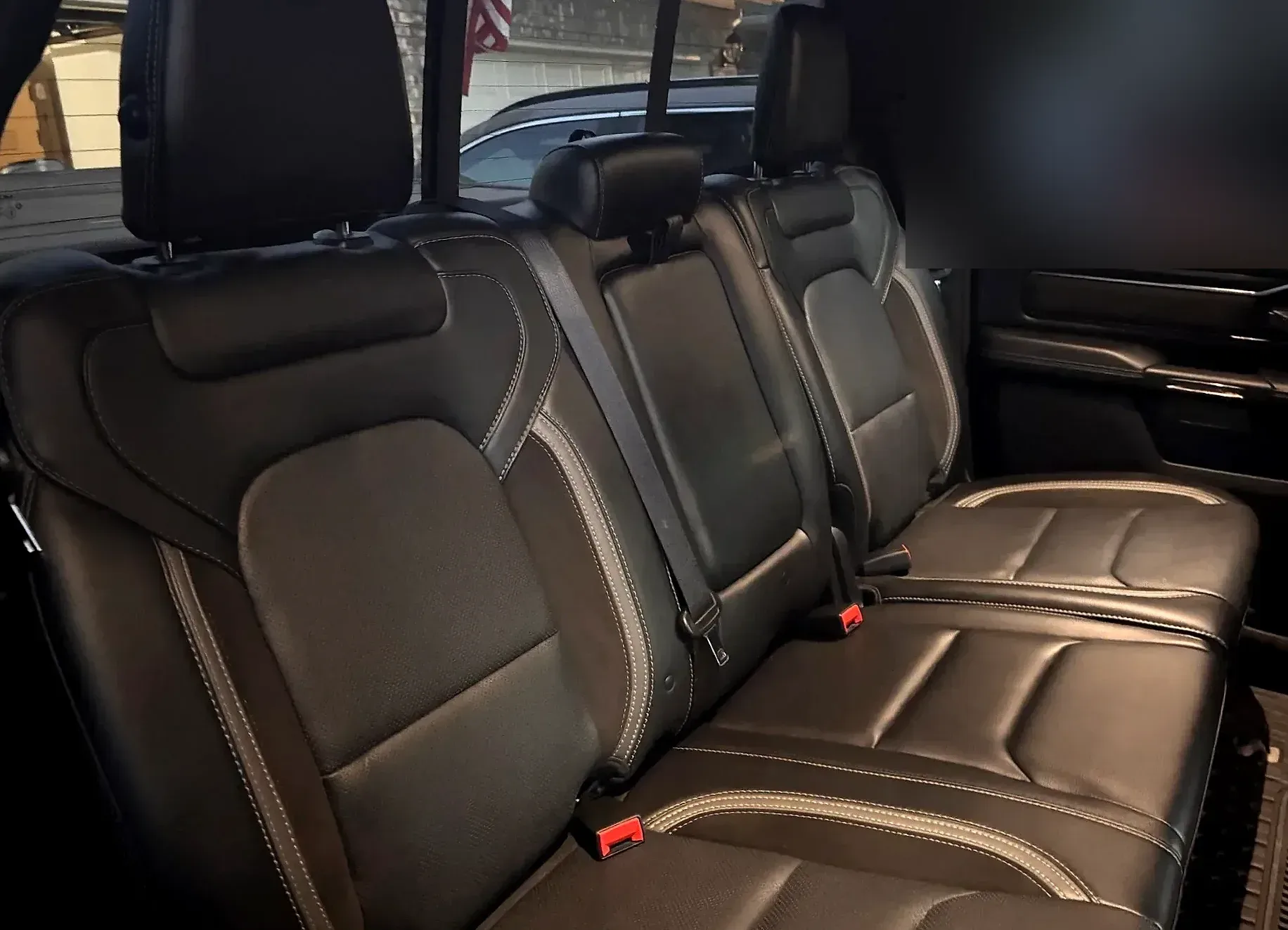 Clean rear leather seats of a black Ram 1500.